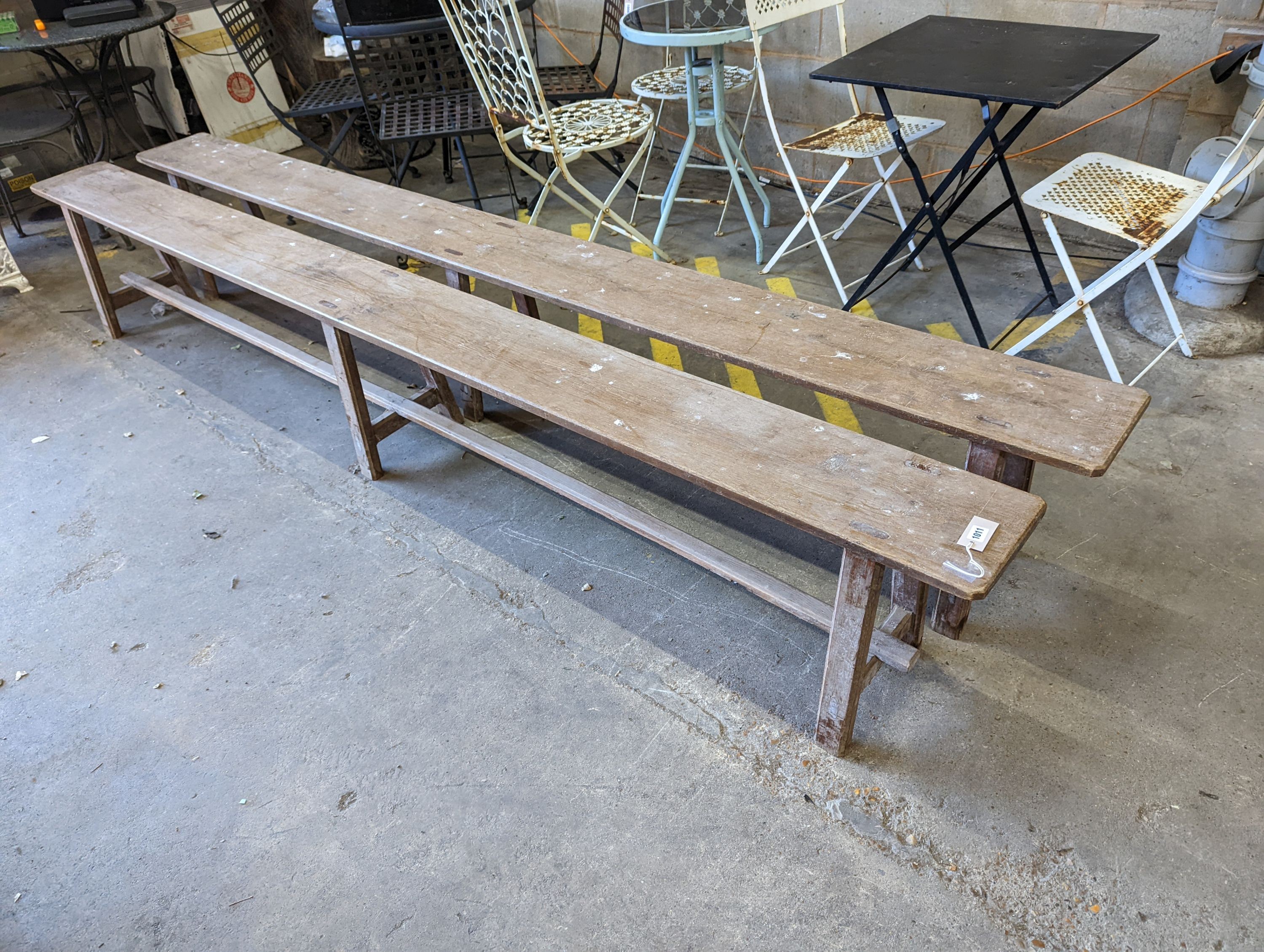 A pair of 19th century French provincial oak long bench seats, length 300cm, depth 24cm, height 45cm